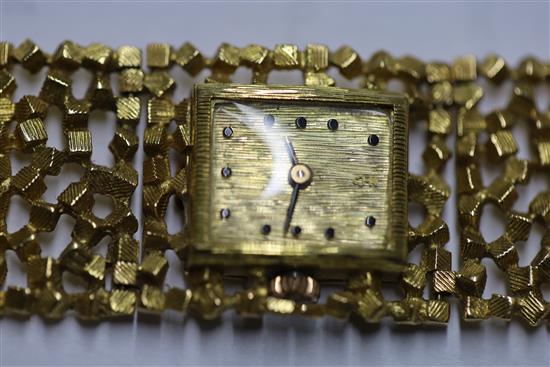 A ladys 18ct gold bracelet wristwatch by John Donald, circa 1970, with Corun movement (bracelet marked JAD) 15.2cm.